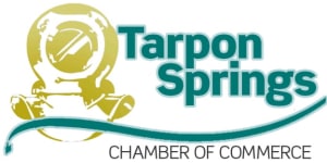 Logo of Tarpon Springs Chamber of Commerce with a sailboat icon.