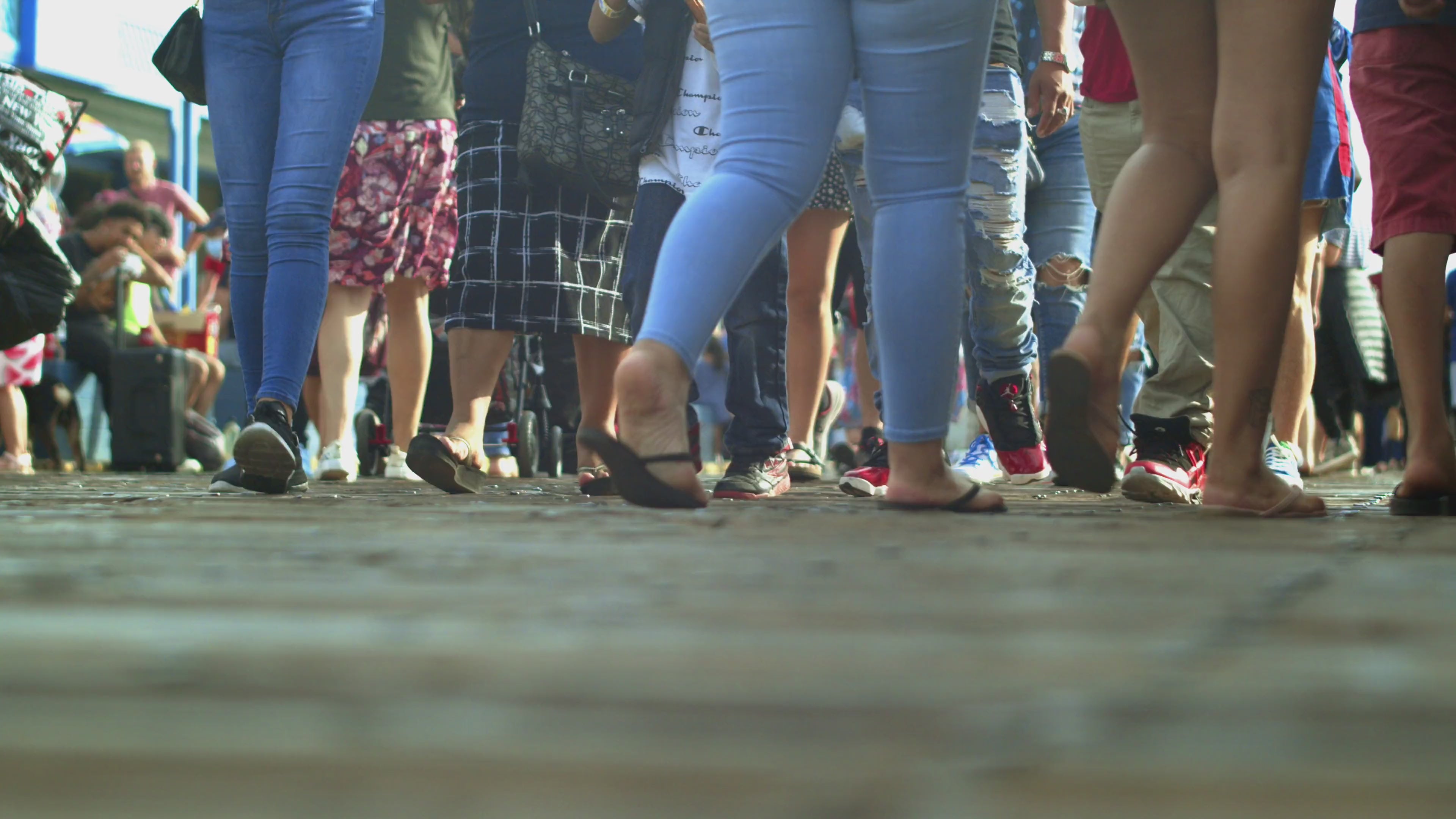 Ground level video shoot of people walking.